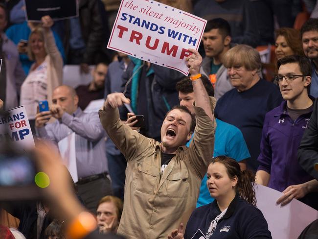 A supporter of Republican presidential candidate Donald Trump heckles demonstrators before the start of a rally at the University of Illinois. Picture: Scott Olson/Getty Images/AFP