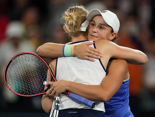 Ashleigh Barty of Australia (right)  hugs opponent Jessica Moore of Australia (left) during their first round doubles match on day four of the Australian Open tennis tournament at Melbourne Arena in Melbourne, Thursday, January 23, 2020. (AAP Image/Michael Dodge) NO ARCHIVING, EDITORIAL USE ONLY