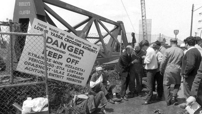 Injured victims sitting along the roadside.