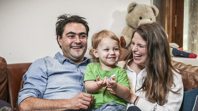 Federal MP Kate Ellis and husband David Penberthy at home with son Sam. Picture: Mike Burton