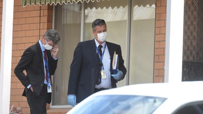 Detectives outside the home. Picture: Tony Gough