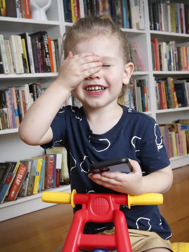 Teddy, 2, plays with his iPhone. Picture: David Caird