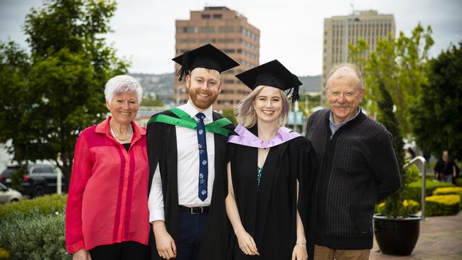 Scott and Emma Caunce (centre) with Linda and David Caunce. University of Tasmania Graduations. Federation Concert Hall, Hobart. Picture: RICHARD JUPE