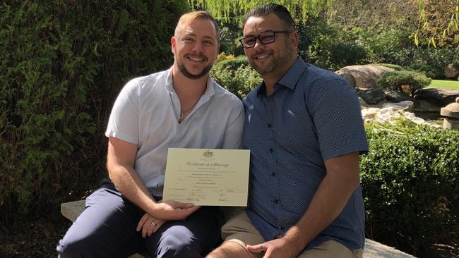 Correctional services officer Stewart Iain Berry, left, and his husband Mathew Campbell, right, on their wedding day. Picture: Supplied.