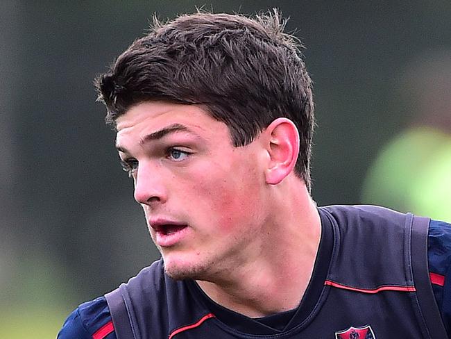 Pictured is Melbourne Football Club AFL training at Casey Fields in Cranbourne East on 9 July 2015. Angus Brayshaw tests his injured neck out at training. Picture: Derrick den Hollander