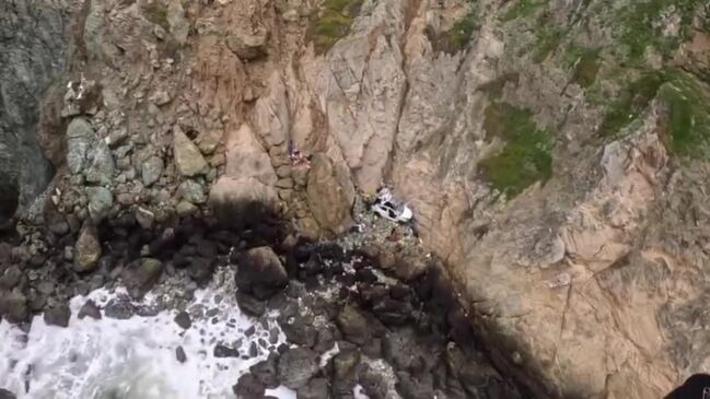 passengers-rescued-after-tesla-plunges-off-cliff-in-california-news