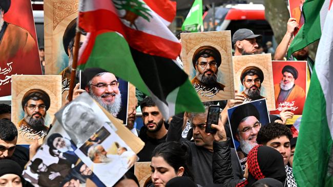 Demonstrators mourn the death of Hassan Nasrallah, late leader of the Lebanese group Hezbollah, at a protest rally in the central business district of Sydney.