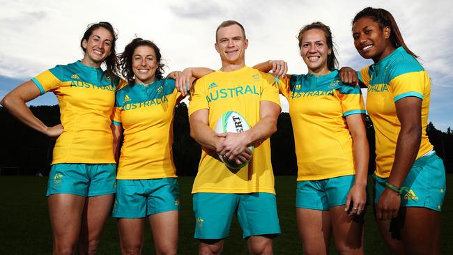 Outgoing sevens coach Tim Walsh (centre) with Australian players Alicia Quirk, Emilee Cherry, Evania Pelite and Ellia Green. Picture: Brett Costello