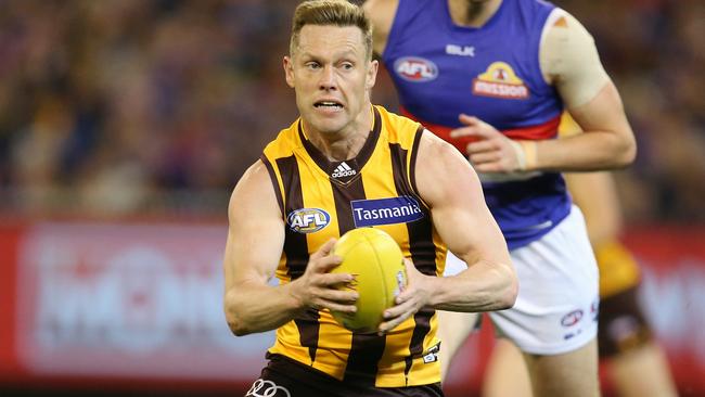 Sam Mitchell getting busy for Hawthorn against the Western Bulldogs.