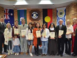 Lismore City Council general manager Gary Murphy (far left) and Lismore mayor Jenny Dowell (far right) with new citizens after the Citizenship Ceremony at the council chambers on Tuesday. Picture: Terra Sword