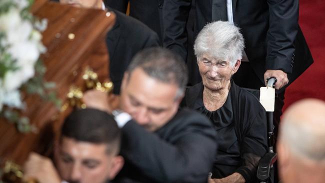 Tony Plati’s 102-year-old mother, Maria, follows her son’s casket out of St Kevin’s Catholic Church, Dee Why. Picture: Julian Andrews.