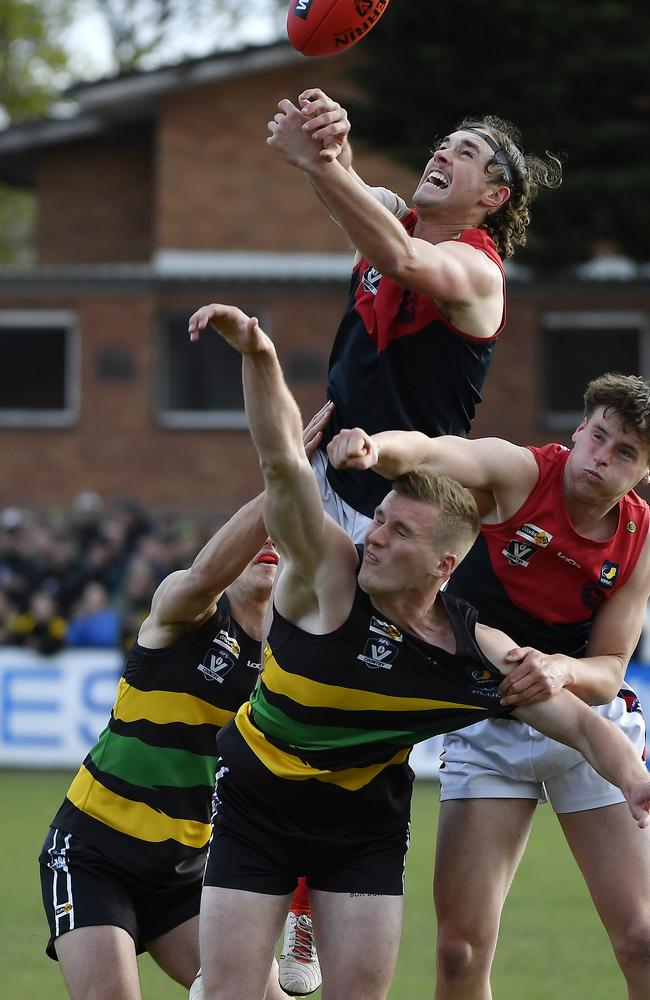 Mt Eliza player Mitch Smith flies for a mark. Picture: Andrew Batsch