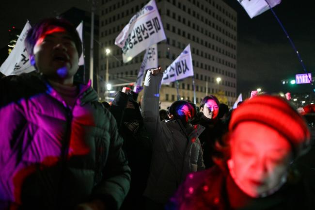 People gathered outside the National Assembly in Seoul after South Korean President Yoon Suk Yeol declared martial law