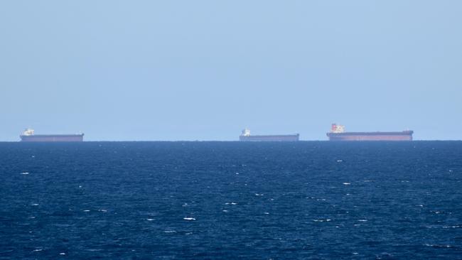 Coal ships off the coast of Mackay awaiting a spot at Hay Point and Dalrymple Bay coal terminals. Picture: Rae Wilson