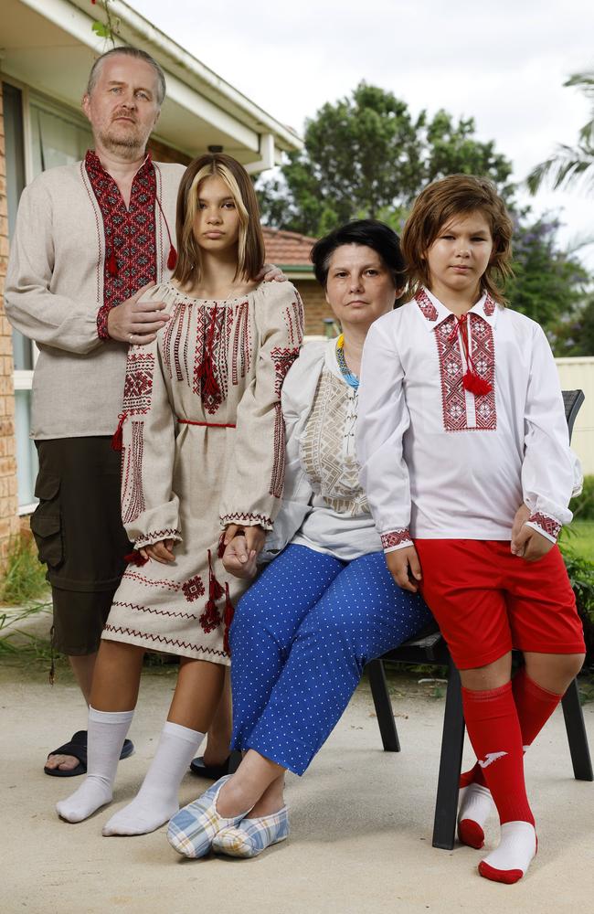 Alex Sinitsky and his wife, Evgenia, with their grandchildren Yaroslava, 13 and Nikita, 9, who came to Australia after their father joined the fight for Ukraine. Picture: Richard Dobson