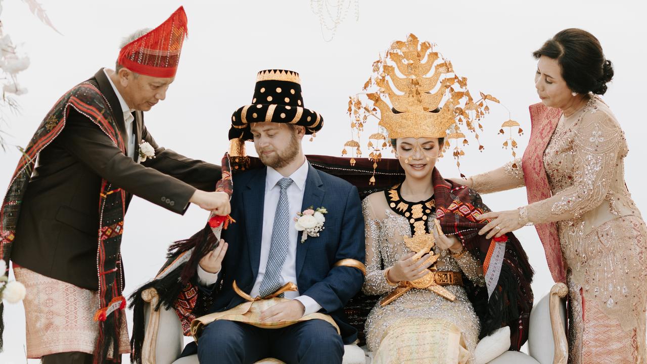 Jack and Fatya, pictured with Fatya’s parents Tri Iriastuti and Fairus Pulungan, held a second ceremony to honour Fatya’s North Sumatran heritage in Bali in July 2022. Picture: Supplied