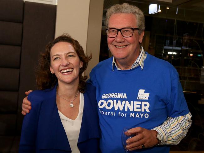 Liberal candidate Georgina Downer reacts with her father Alexander Downer at the Barker Hotel, Adelaide, South Australia, Saturday, July 28, 2018. Dubbed "Super Saturday", five federal simultaneous byelections will be held today, unprecedented in Australian election history after sitting members of parliament were forced to resign due to dual citizenship in breach of the Constitution. (AAP Image/Kelly Barnes) NO ARCHIVING