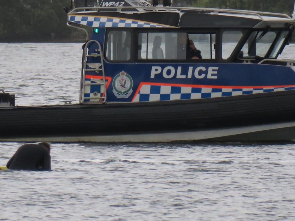 Police are working to retrieve the car and the man’s body. Picture: Richard Noone