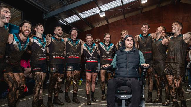 Ryan Wiggins joins his team mates for the first time since his accident to sing the Cygnet Football Club song after a home win. Picture: Linda Higginson