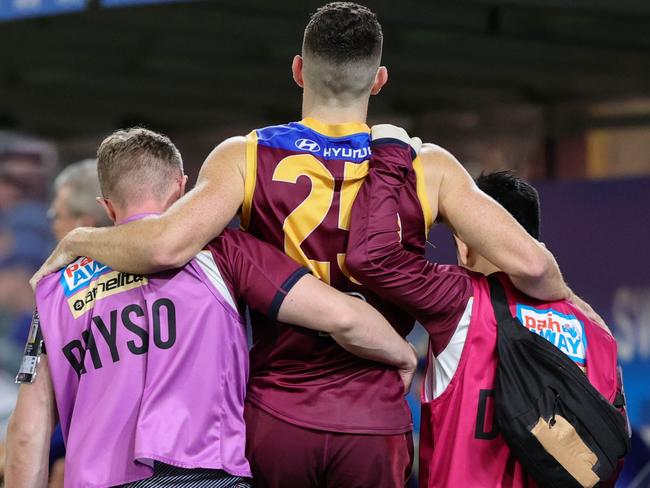 BRISBANE, AUSTRALIA - MAY 07: Daniel McStay of the Lions is seen being helped to the bench after leaving the match injured during the 2022 AFL Round 08 match between the Brisbane Lions and the West Coast Eagles at the Gabba on May 07, 2022 in Brisbane, Australia. (Photo by Russell Freeman/AFL Photos via Getty Images)