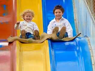 Claire and Hamish Morgan enjoy the rides at the 2019 Mount Perry Show. Picture: Felicity Ripper