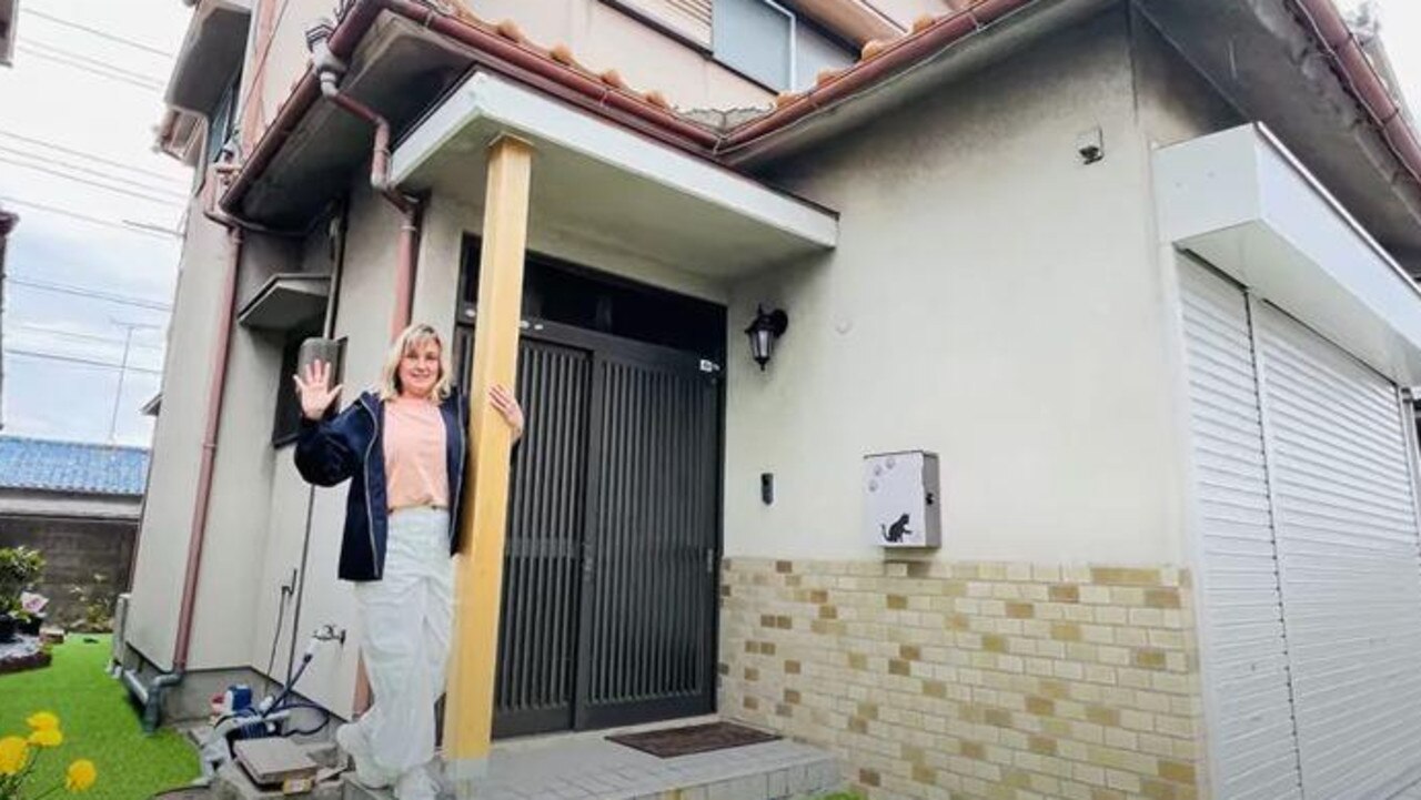 An Aussie woman, Chani, pictured outside the abandoned home she bought in Wakayama for $20,000. Picture: YouTube: Chani Japan