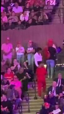 Woman escorted out of Trump rally after flashing her breasts in the stands