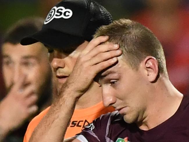 Lachlan Croker of the Eagles is taken off the pitch after injuring himself during the NRL Round 8 match between the Manly-Warringah Sea Eagles and Newcastle Knights at Lottoland in Sydney, Friday, April 27, 2018. Pearce sustained a ruptured pectoral muscle in Saturday's Round 7 match at Tamworth against the Wests Tigers. (AAP Image/David Moir) NO ARCHIVING, EDITORIAL USE ONLY