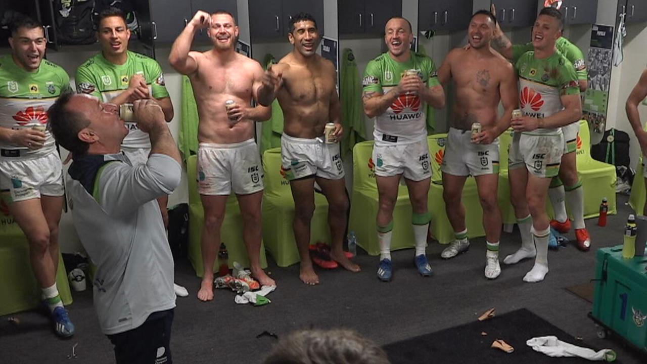 Ricky Stuart downs a beer to celebrate the win