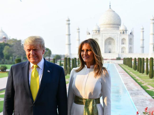 US President Donald Trump and First Lady Melania Trump pose as they visit the Taj Mahal in Agra on February 24, 2020. (Photo by Mandel NGAN / AFP)