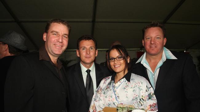 Todd Kelly, Rick Chapman and Eddie Whiteside are served some sushi by Georgina Cogzell at the 2008 event. Picture: Nicholas Falconer