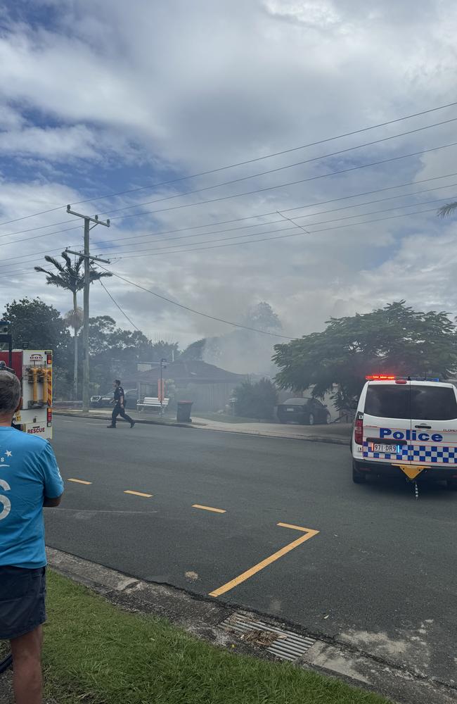 Residents watched on as firefighters investigated the blaze. Picture: Beau Herbert-Cummings