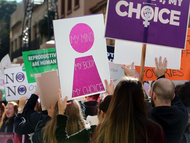 Pro life and pro choice protestors gathered at the front of NSW State Parliament in Sydney ahead of the debate of a possible abortion bill. Picture: Richard Dobson