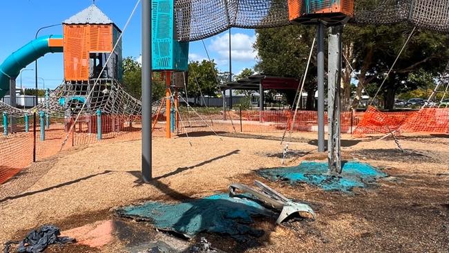 Splotches of melted blue plastic in the Thornlands playground that was burned in an alleged firebomb attack. Pictures: Contributed