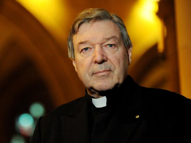 Archbishop of Sydney, Cardinal George Pell at the unveiling of a painting entitled 'Our Lady of the Southern Cross, Help of Christians' featuring the Virgin Mary wearing a garland of wattle at St Mary's Cathedral in Sydney, Friday, July 11, 2008. World Youth Day events officially commenced with the unveiling of the painting by artist Paul Newton. (AAP Image/Tracey Nearmy) NO ARCHIVING