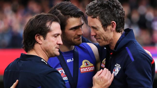 Bob Murphy joins Luke Beveridge and Easton Wood on the premiership dais. Picture. Phil Hillyard