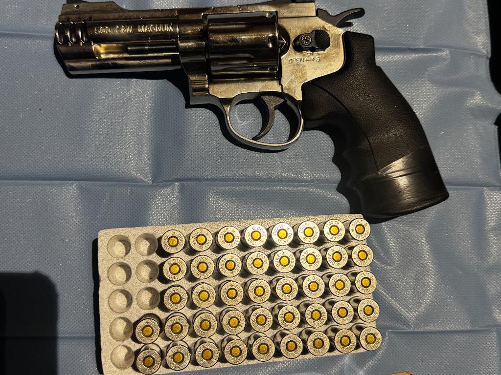 Officers located and seized a revolver and over 50 live rounds of ammunition. Photo: NSW Police.