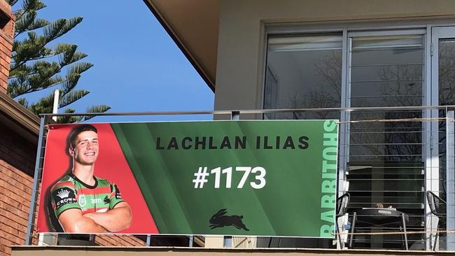 Lachlan Ilias’ family can’t get to Brisbane, so they made him a banner for him.