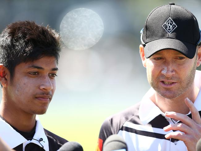 SYDNEY, AUSTRALIA - SEPTEMBER 24:  Michael Clarke and Sandeep Lamichhane speak to the media during the innings break during the Mosman v Western Suburbs first grade match at Allan Border Oval on September 24, 2016 in Sydney, Australia.  (Photo by Mark Metcalfe/Getty Images)