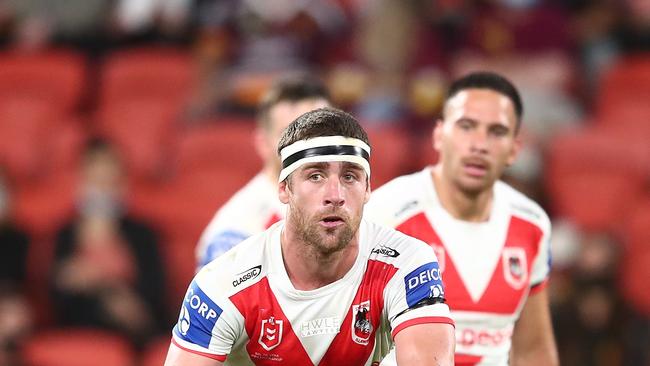 BRISBANE, AUSTRALIA – AUGUST 13: Andrew McCullough of the Dragons passes during the round 22 NRL match between the St George Illawarra Dragons and the Penrith Panthers at Suncorp Stadium, on August 13, 2021, in Brisbane, Australia. (Photo by Chris Hyde/Getty Images)