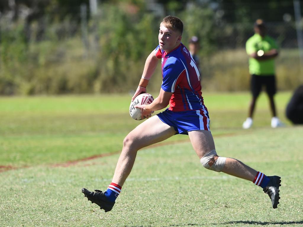 Boys Rugby League State Championship held at Northern Division, Brothers Leagues ground, Townsville. 16-18 years. Peninsula (stripe) v Darling Downs (blue/purple). Bodhi Sharpely of St Mary's College, Toowoomba.