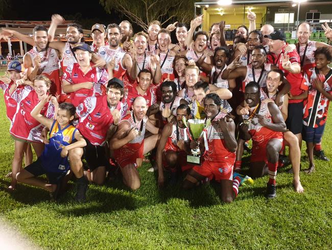 Winners are grinners: Katherine Souths players show off the  BRFL premiership cup last night. Picture: Grey Morris