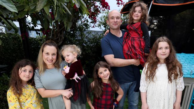 Candice and Mike Meisels with their daughters (L-R) Hannah, 9, Jasmine, 3, Talya, 4, Abby, 7, and Chloe, 11, at home in Bondi Juction. The girls will return to school on different days. Picture: Damian Shaw