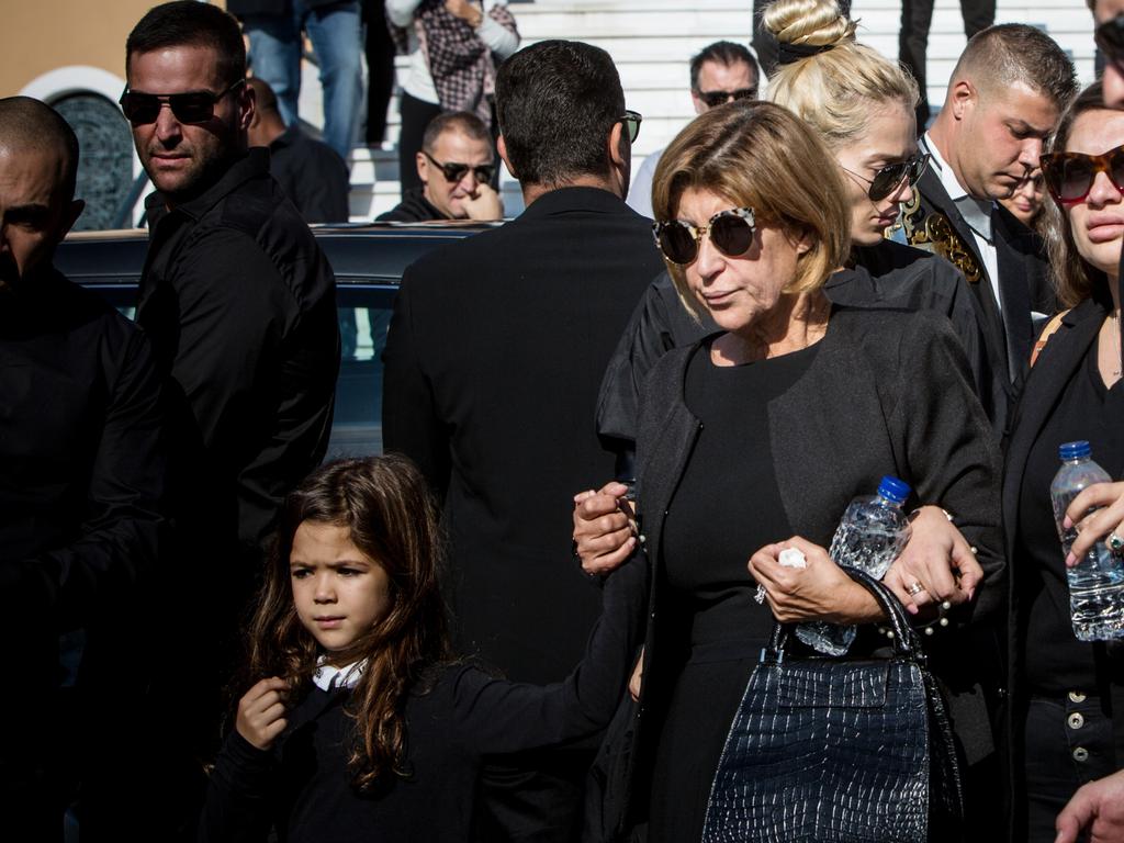 John Macris’ mother holding a child’s hand at his funeral. Picture: Angelos Christofilopoulos/News Corp