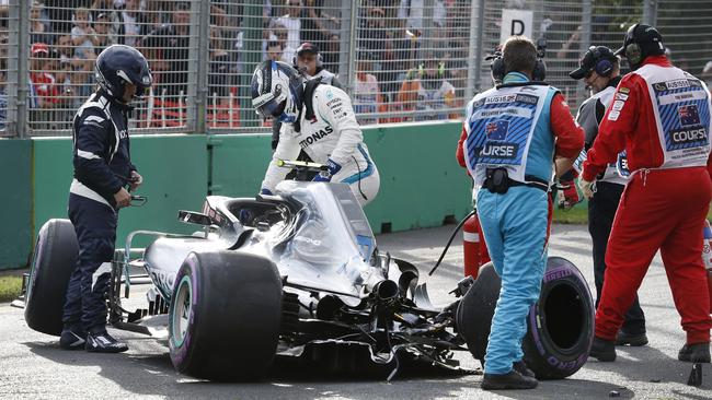 Valtteri Bottas gets out of his wrecked car uninjured after crashing in qualifying at the Australian GP.
