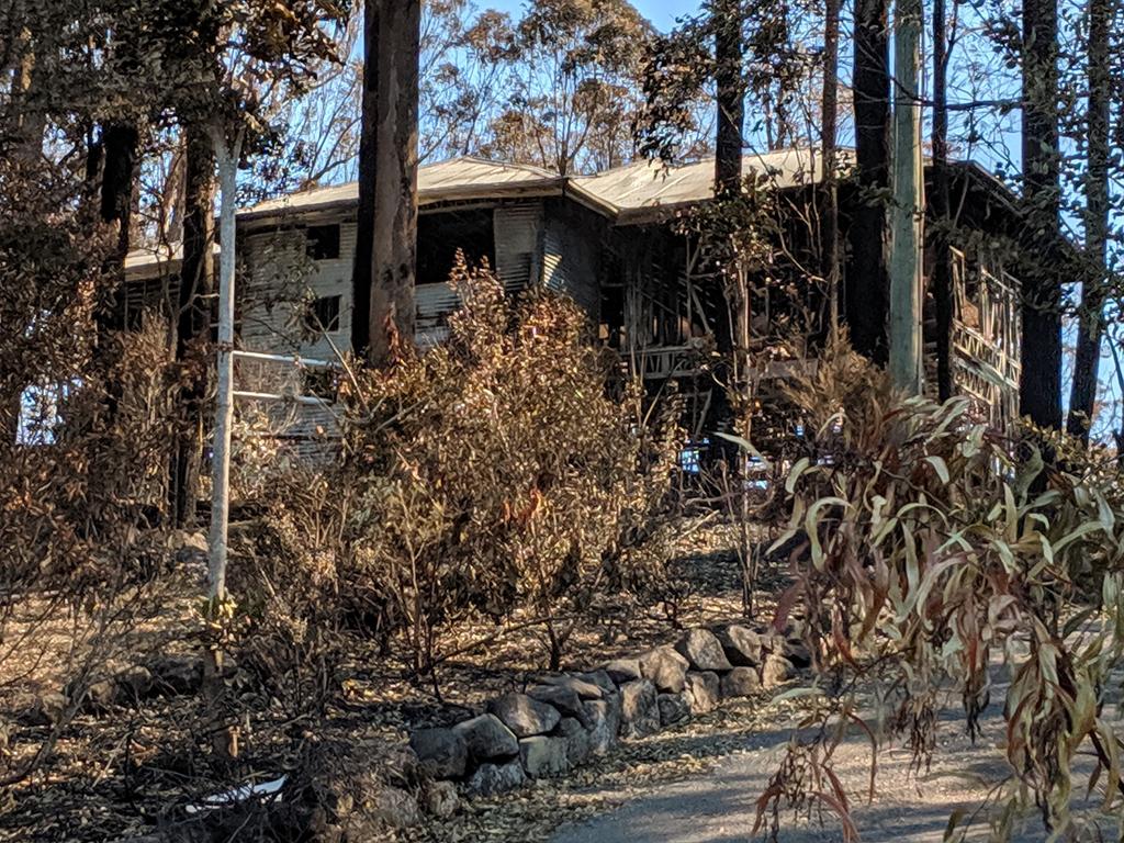 A badly-damaged house. Picture: Luke Mortimer.