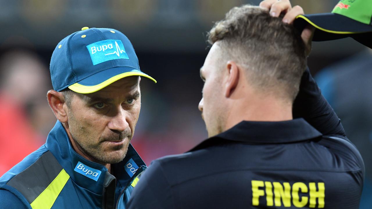 Australian coach Justin Langer (left) speaks with captain Aaron Finch prior to the T20 International match between Australia and South Africa, at Metricon Stadium, on the Gold Coast, Saturday, November 17, 2018. (AAP Image/Dave Hunt) NO ARCHIVING, EDITORIAL USE ONLY, IMAGES TO BE USED FOR NEWS REPORTING PURPOSES ONLY, NO COMMERCIAL USE WHATSOEVER, NO USE IN BOOKS WITHOUT PRIOR WRITTEN CONSENT FROM AAP