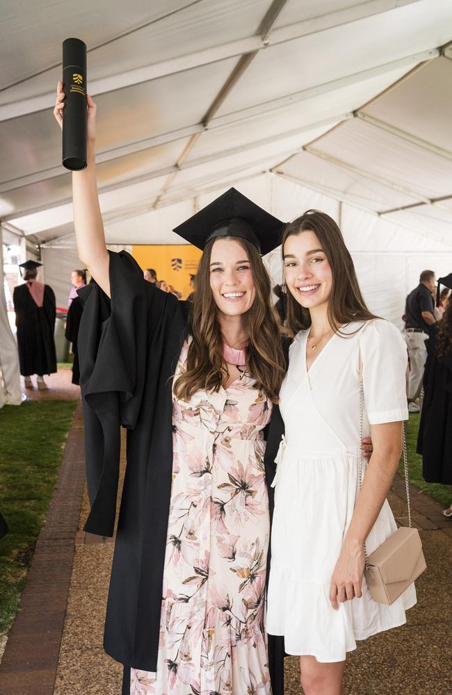 Master of Learning and Teaching graduate Alexandra Duro with sister Hannah Acutt at a UniSQ graduation ceremony at Empire Theatres, Tuesday, October 31, 2023. Picture: Kevin Farmer