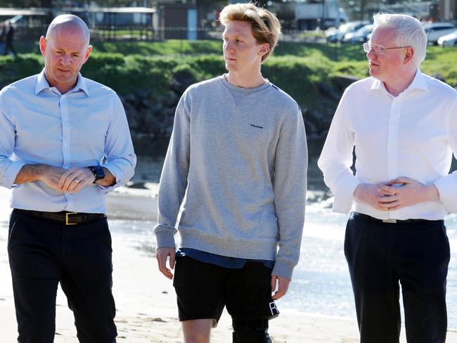 Bombo shark attack victim Brett Connellan with NSW Primary Industries Minister Niall Blair and local member for Kiama Gareth Ward.Picture: Simon Bullard