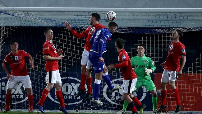 Milos Lujic heads home a dramatic late winner against Edgeworth. Picture: Getty Images